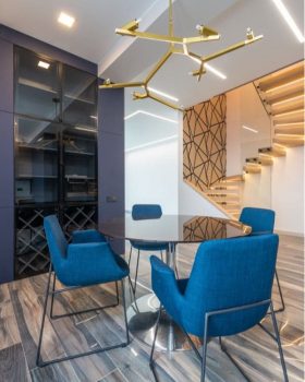 Blue dining seats with round table — Project Management & Interior Designers in South East Queensland